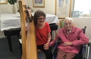 Therapeutic harp hits the right note on International Volunteer Day