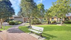 Bupa-Aged-Care-Kempsey-garden-with-chair